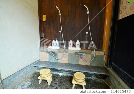 A simple shower space at a hot spring inn: a scene from a traditional Japanese-style washing area A simple shower space at a hot spring inn: a scene from a traditional Japanese-style washing area 114615473