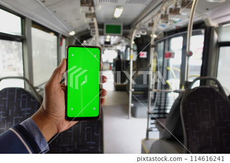 passenger sitting in a bus using his phone with green screen passenger sitting in a bus using his phone with green screen 114616241