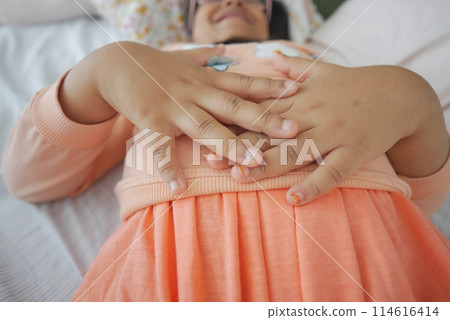 child suffering stomach pain close up. child suffering stomach pain close up. 114616414