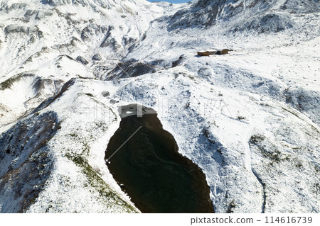 Aerial view of early winter near Murododaira Mikurigaike pond, mountain hut and thin ice on Midogaike pond below Aerial view of early winter near Murododaira Mikurigaike pond, mountain hut and thin ice on Midogaike pond below 114616739