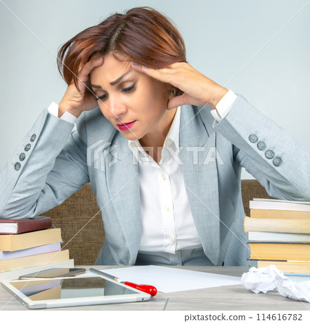 Business woman tired in the office and worried in emotions. Stress and headache Business woman tired in the office and worried in emotions. Stress and headache 114616782