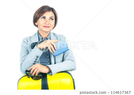 Happy beautiful business woman with passport and baggage going on a trip 114617367