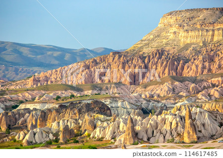 Volcanic rocks and limestone cliffs in Cappadocia valley. Turkey. Tourism and travel. 114617485
