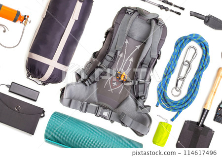 Set of tourist trekking items on white background. Top view of accessories for travel. Set of tourist trekking items on white background. Top view of accessories for travel. 114617496