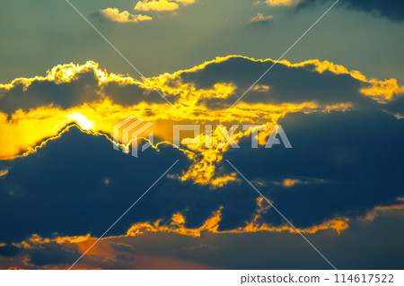 brightly colorful clouds in the evening sky. Lush colored clouds in the sky before sunset 114617522