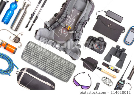 Set of tourist trekking items on white background. Top view of accessories for travel. Set of tourist trekking items on white background. Top view of accessories for travel. 114618011