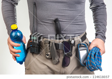 water, sunglasses, walkie-talkie, flashlight, knife, GPS navigator, climbing rope on the belt  114618037