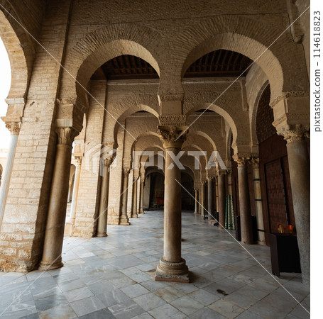 Long corridors under vaulted ceiling in ancient mosque of Kairouan in Tunisia. Long corridors under vaulted ceiling in ancient mosque of Kairouan in Tunisia. 114618823