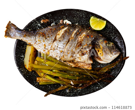 Dorada fish served with potatoes and asparagus Dorada fish served with potatoes and asparagus 114618873