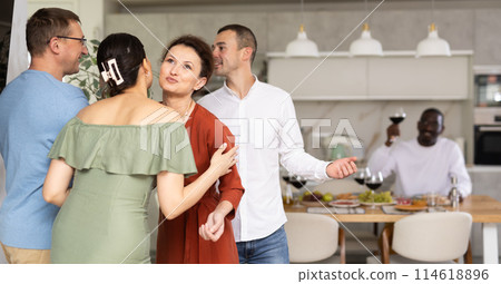 Group of friends greeting each other 114618896