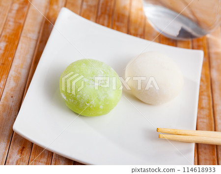 Green tea and vanilla mochi ice cream balls on plate Green tea and vanilla mochi ice cream balls on plate 114618933