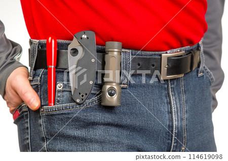 Pen, knife and flashlight with clips in your jeans pocket. EDC items 114619098