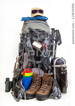 Items for tourism and hiking near a tourist backpack on a white background 114619300