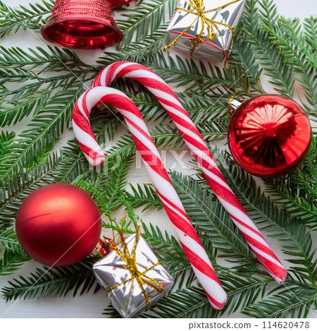 Red Christmas ornaments and candy sweets Red Christmas ornaments and candy sweets 114620478