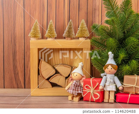 Christmas background with wooden objects, fir trees, presents and cute dolls 114620488