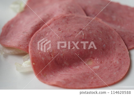 Salami smoked sausage slices on white background. 114620588