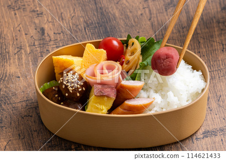 Lunch box with pickled plums Lunch box with pickled plums 114621433