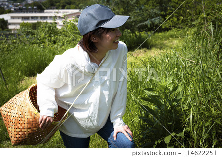 Cute woman enjoying country life Cute woman enjoying country life 114622251