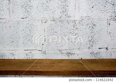 Wooden shelves on white concrete wall background For display 114622842