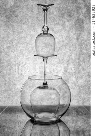 Still life with glassware on a reflective surface 114622922