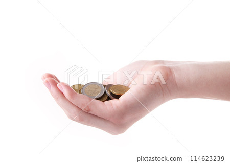 A female hand hold a coin isolated white at the studio. 114623239