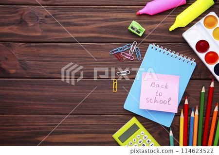 Back to school concept on brown wooden background, top view Back to school concept on brown wooden background, top view 114623522