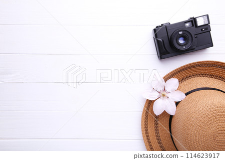 Traveler accessories on white wooden background Travel vacation concept. Summer background. Traveler accessories on white wooden background Travel vacation concept. Summer background. 114623917