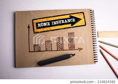 Home Insurance. Direction arrow with text on office desk 114624388