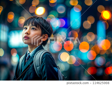 Young boy with backpack standing in front of city at night. Generative AI Young boy with backpack standing in front of city at night. Generative AI 114625008