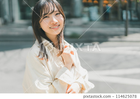A young lady walking in the city A young lady walking in the city 114625078