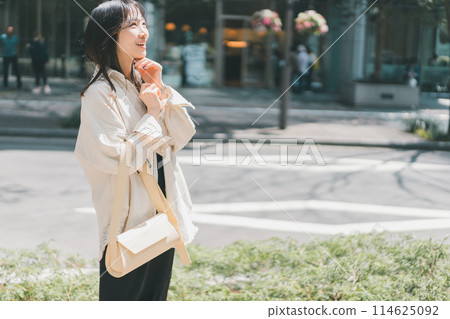 A young lady walking in the city A young lady walking in the city 114625092
