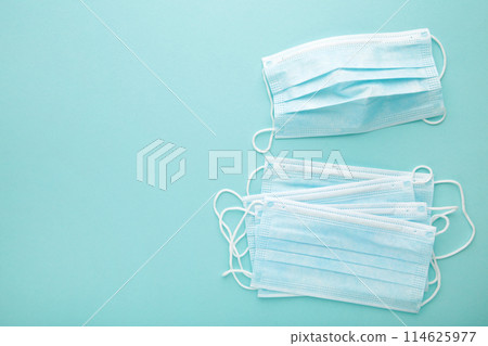 Medical masks on a blue background with copy space. Coronavirus Medical masks on a blue background with copy space. Coronavirus 114625977