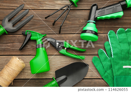 Gardening tools on grey wooden background, top view Gardening tools on grey wooden background, top view 114626055