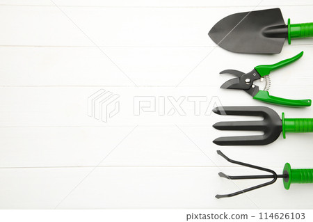 Gardening tools on white wooden background, top view 114626103
