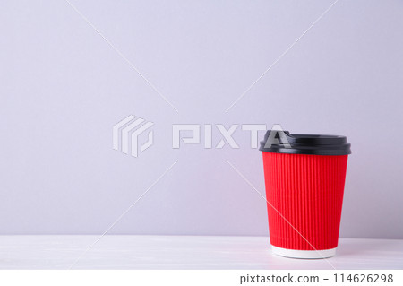 Red paper cup of coffee on grey wooden background 114626298