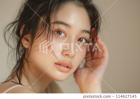 Woman with beautiful face touching healthy facial skin portrait. Beautiful happy Asian girl model with natural Woman with beautiful face touching healthy facial skin portrait. Beautiful happy Asian girl model with natural 114627145