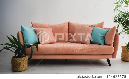 Peach color sofa with pillows 114628576