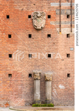 historical reliefs on ancient roman brick wall 114629706