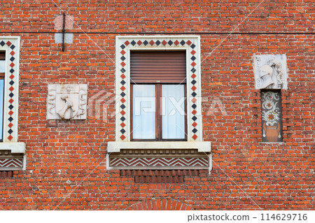 intricately designed brick facade with historical details intricately designed brick facade with historical details 114629716