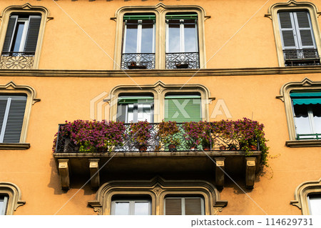vibrant flower balcony on a traditional european building 114629731