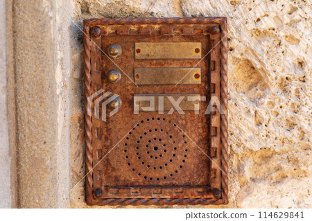 vintage intercom on weathered stone wall vintage intercom on weathered stone wall 114629841