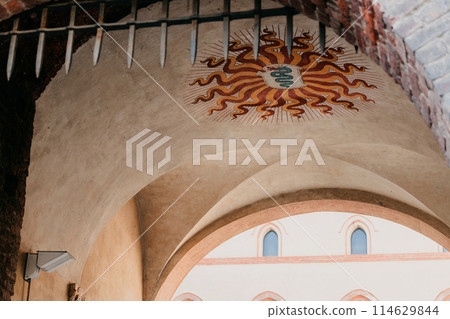 sun emblem painted over stone archway sun emblem painted over stone archway 114629844