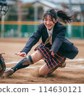 Students in uniforms sliding and playing baseball 114630121