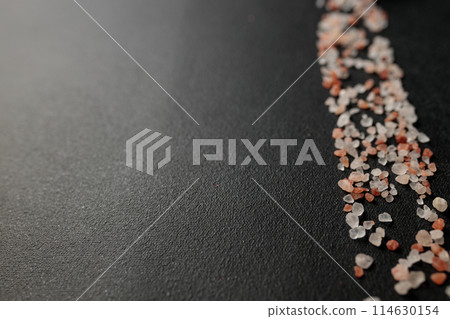 Colored Himalayan salt on a black background. Straight line Space for text Colored Himalayan salt on a black background. Straight line Space for text 114630154