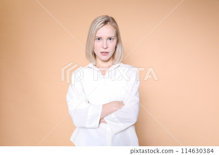 Foreign woman's facial expression Foreign woman's facial expression 114630384