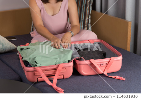 Packing for a trip. 114631930