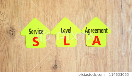 SLA service level agreement symbol. Concept words SLA service level agreement on beautiful yellow paper. Beautiful wooden background. Business SLA service level agreement concept. Copy space. SLA service level agreement symbol. Concept words SLA service level agreement on beautiful yellow paper. Beautiful wooden background. Business SLA service level agreement concept. Copy space. 114633063