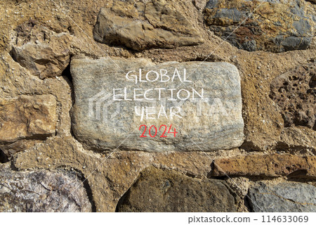 Global election year 2024 symbol. Concept words Global election year 2024 on beautiful big grey stone. Beautiful stone wall background. Business Global election year 2024 concept. Copy space 114633069