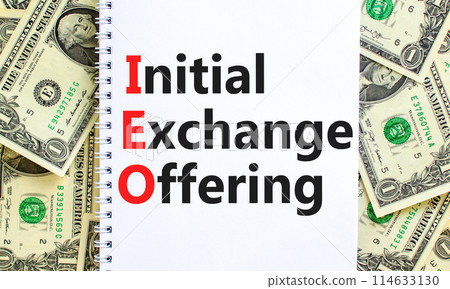 IEO initial exchange offering symbol. Concept words IEO initial exchange offering on beautiful note. Beautiful dollar bills background. Business IEO initial exchange offering concept. Copy space. IEO initial exchange offering symbol. Concept words IEO initial exchange offering on beautiful note. Beautiful dollar bills background. Business IEO initial exchange offering concept. Copy space. 114633130