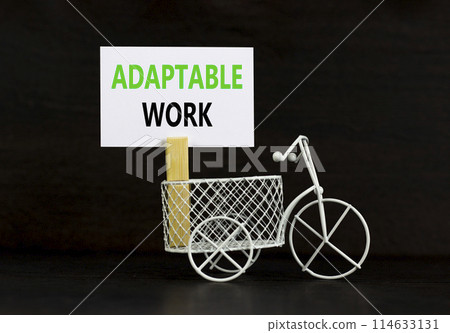 Adaptable work symbol. Concept words Adaptable work on beautiful white paper on wooden clothespin. Beautiful black background. Bike model. Business Adaptable work concept. Copy space. 114633131